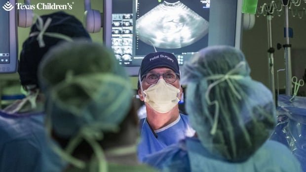 Unborn baby has pioneering surgery inside the womb. Now his doctor is waiting to see if it was a success