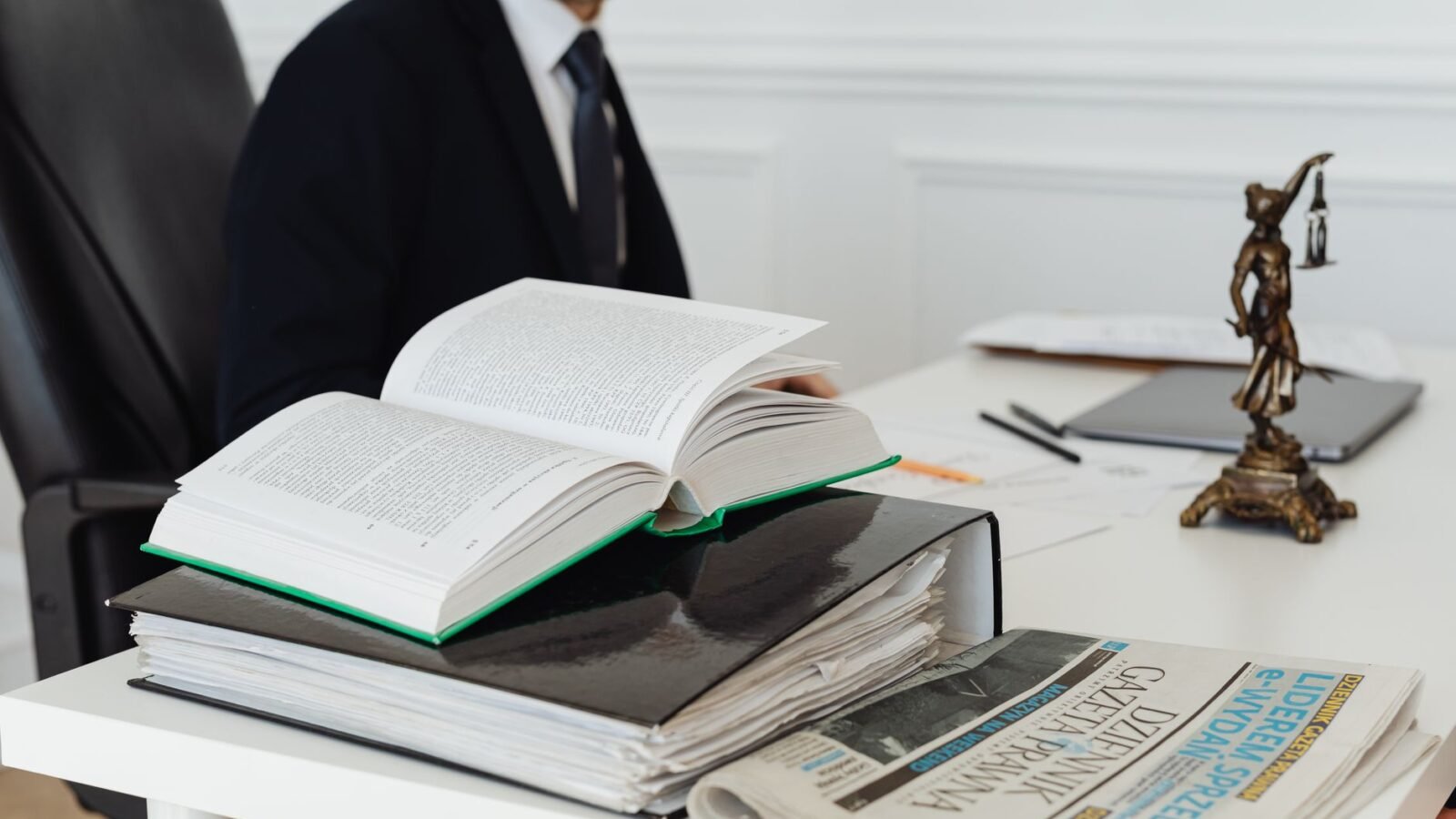 Legal documents and scales of justice symbolising court proceedings